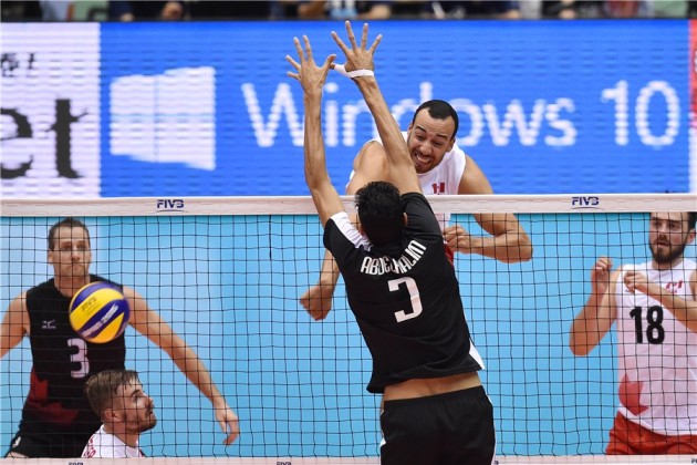 Justin Duff of Canada spikes the ball