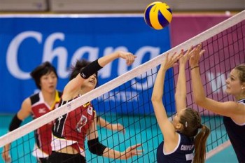 Japan's Haruka Maruo overcomes the taller Greece's blockers with her spike