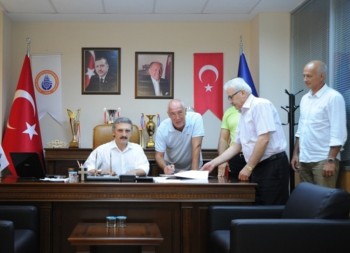 Ozbey signing contract